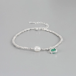 S925 sterling silver bracelet featuring irregular silver beads, pearl and emerald charm