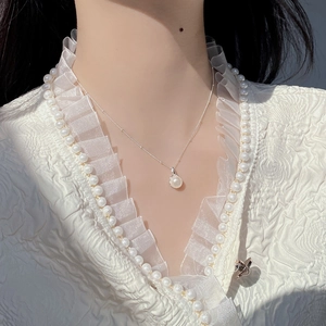 Elegant S925 sterling silver necklace featuring a natural round white pearl pendant