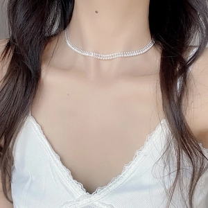 Close-up of S925 silver choker necklace with shimmering rectangular zircon stones
