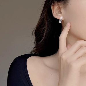 Elegant 925 sterling silver geometric zircon stud earrings for women shown on model