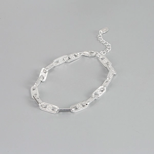 Detail of S925 silver chain bracelet with clover patterns and black zircon stones