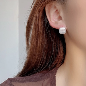 Minimalist matte S925 sterling silver square stud earrings worn by a model for daily style