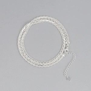 Detailed close-up of S925 sterling silver woven flat chain with heart charm and clasp