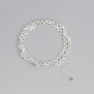 Detailed macro view of S925 sterling silver heart-shaped chain links with pendant