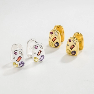 Close-up of S925 sterling silver earrings with colorful zircons and engraved hallmark