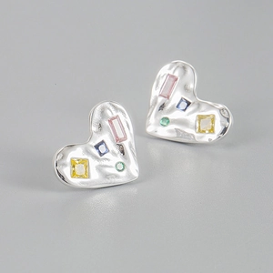 Detailed close-up of heart-shaped silver earrings with colorful square zircon stones