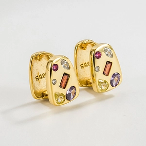 Close-up of S925 sterling silver huggie earrings with colorful zircon gemstones