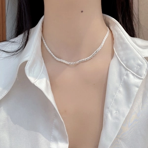 Minimalist S925 sterling silver twisted rope chain necklace worn on an elegant model