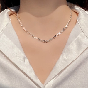 Close-up of S925 sterling silver necklace featuring delicate interlocking heart-shaped links