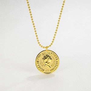 Macro detail of a 925 sterling silver vintage gold coin pendant with queen portrait