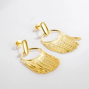 Detail shot of long gold tassel earrings showing S925 sterling silver hallmark engraving