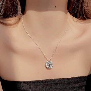 Vintage 925 sterling silver Elizabeth II coin necklace with elegant ball chain on model
