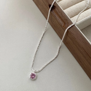 Elegant S925 sterling silver halo necklace featuring a round pink zircon pendant