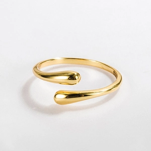 Macro shot of S925 sterling silver water drop ring showing inner hallmark and golden finish