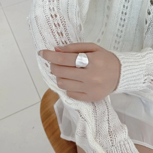Detail view of a matte S925 sterling silver wide band ring with brushed texture finish