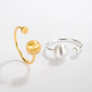 Detail of minimalist S925 sterling silver ball rings with brushed matte finish