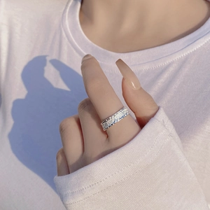 Retro S925 sterling silver ring with embossed floral pattern worn on hand