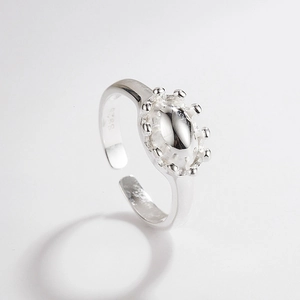 Detailed macro view of S925 sterling silver ring with oval crown design and beaded border