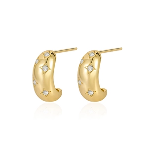 Polished gold C-shape hoop earrings with star-set zircon accents on white background