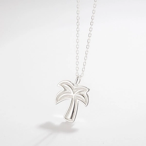 Detailed close-up of S925 sterling silver palm tree pendant with a polished finish