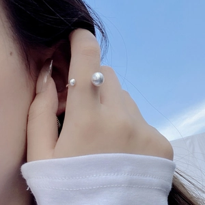 Minimalist S925 sterling silver brushed ball open ring shown against a blue sky background