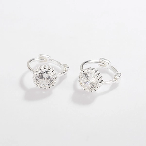 Macro view of 925 silver stud earrings with round micro-pave cubic zirconia crystals