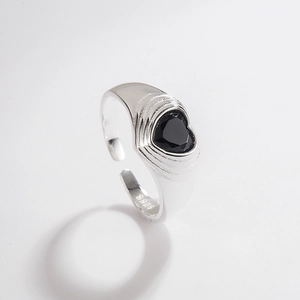 Detailed macro view of S925 sterling silver heart-shaped black zircon open ring texture