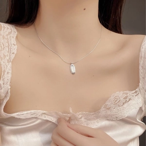 Elegant S925 sterling silver oval necklace with white shell inlay worn by model
