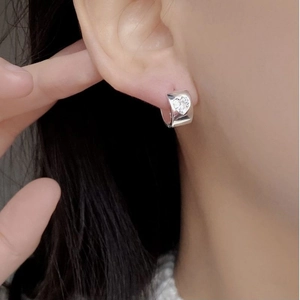 Minimalist S925 sterling silver heart zircon hoop earrings shown on a model