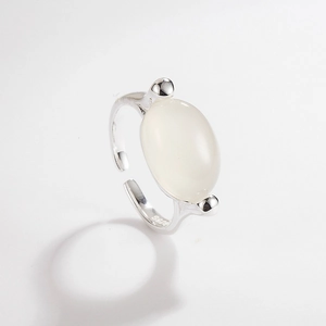Macro shot of S925 sterling silver open ring featuring oval translucent white gemstone