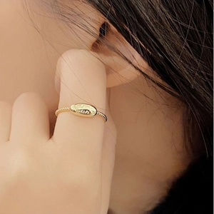 Twisted band gold ring with oval surface engraved with Best You for minimalist women