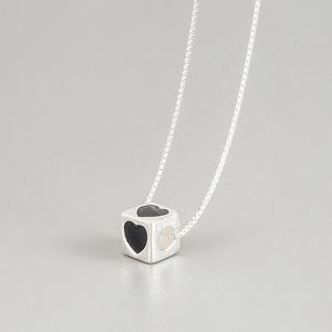 Detailed close-up of S925 sterling silver cube pendant with black heart pattern