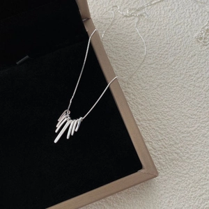 Minimalist S925 sterling silver fringe necklace with geometric bars on black velvet