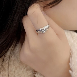 S925 sterling silver heart zircon ring with layered texture worn by a model