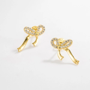 Close-up of S925 sterling silver bow earrings with micro-set cubic zirconia details