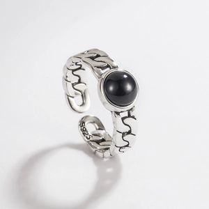Detail shot of vintage 925 sterling silver ring with black onyx and S925 hallmark
