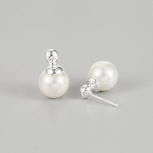 Close-up of elegant round pearl earrings with 925 sterling silver studs on grey background