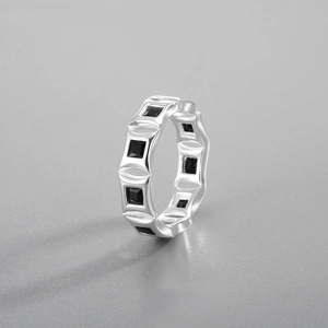 Close-up of geometric S925 sterling silver ring featuring inlaid square black zircon stones