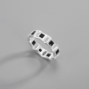 Detailed view of S925 sterling silver ring with square black zircons in a geometric band