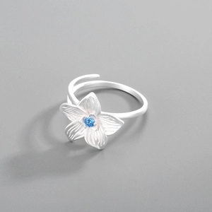 Close-up of S925 silver hibiscus flower ring with blue zircon and adjustable band
