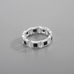 Macro view of adjustable S925 silver ring featuring square black zircon stone settings