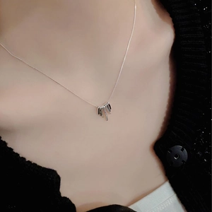 Minimalist S925 sterling silver necklace with geometric fringe pendant on female model