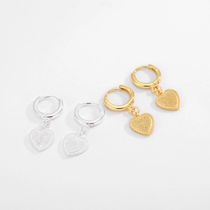 Close-up of S925 sterling silver heart hoop earrings with frosted texture in gold and silver