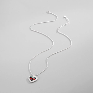 Detail of S925 sterling silver heart pendant with red and green enamel cherry motif