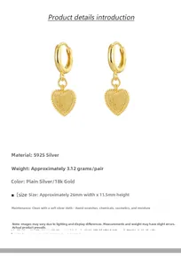 Macro detail of 18k gold heart hoop earrings with S925 silver specs and dimensions