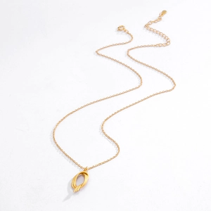 Detail of S925 silver necklace with golden twisted geometric pendant and thin chain
