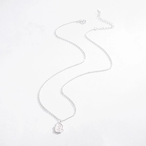 Close-up of S925 silver irregular pendant with Love and be loved engraving