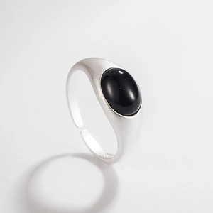 Macro detail of S925 sterling silver stamp on matte ring with black agate stone