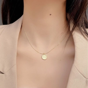 Detailed view of 925 silver gold necklace with 'all is well' engraved round pendant