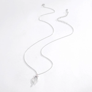 Detail of S925 sterling silver necklace with matte irregular oval pendant and chain